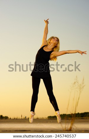Professional gymnast woman dancer in black clothing