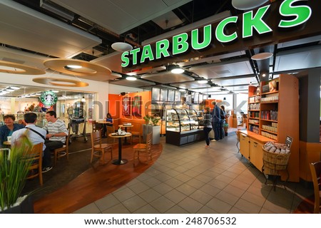 GENEVA - SEP 11: Starbucks cafe interior on September 11, 2014 in Geneva, Switzerland. Starbucks is the largest coffeehouse company in the world, with more then 23000 stores