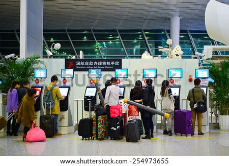 SHENZHEN, CHINA - FEBRUARY 16, 2015: airport interior. Shenzhen Bao\'an International Airport is located near Huangtian and Fuyong villages in Bao\'an District, Shenzhen, Guangdong