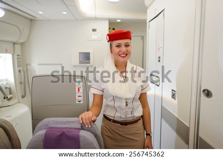 DUBAI, UAE - DECEMBER 10, 2014: Emirates Airbus A380 crew member. Emirates handles major part of passenger traffic and aircraft movements at the airport.