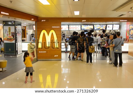 HONG KONG - APRIL 03, 2015: McDonald\'s restaurant interior. The McDonald\'s Corporation is the world\'s largest chain of hamburger fast food restaurants, serving around 68 million customers daily