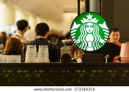 HONG KONG - MARCH 09, 2015: airport Starbucks cafe. Starbucks is the largest coffeehouse company in the world, with more then 23000 stores