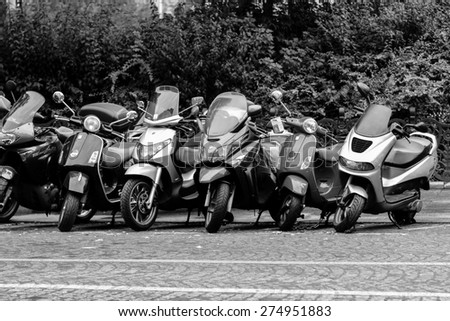 PARIS - SEPTEMBER 06: modern and vintage motorbikes parked in the street on September 06, 2014 in Paris, France. Paris, aka City of Love, is a popular travel destination and a major city in Europe