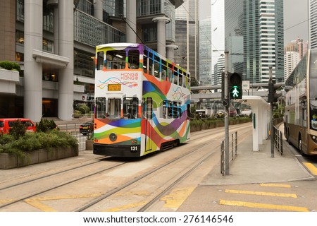 HONG KONG - MAY 05, 2015: double-decker tram on street of HK. Hong Kong Tramways is a tram system in Hong Kong, being one of the earliest forms of public transport in the metropolis.