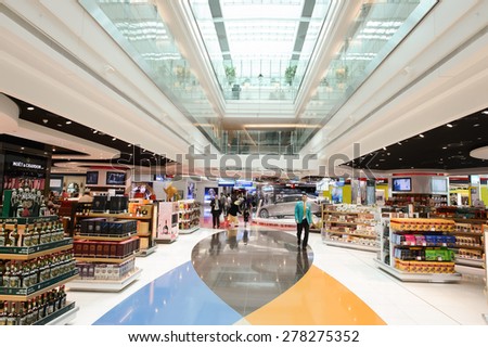 DUBAI - MARCH 10, 2015: Dubai duty-free shopping area interior. Dubai International Airport is the primary airport serving Dubai and is the world\'s busiest airport by international passenger traffic