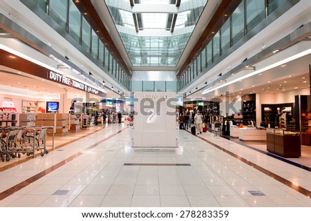 DUBAI - MARCH 10, 2015: The Dubai duty-free shopping area. Dubai International Airport is the primary airport serving Dubai and is the world\'s busiest airport by international passenger traffic