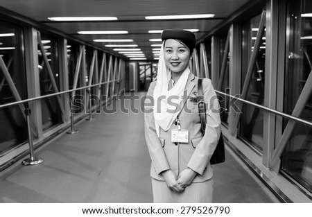 MOSCOW -JUNE 04: Emirates crew member on June 04, 2014 in Moscow, Russia. Emirates handles major part of passenger traffic and aircraft movements at the airport.