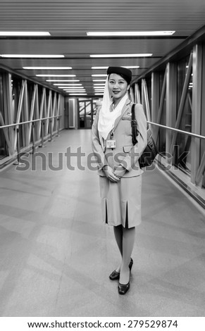 MOSCOW -JUNE 04: Emirates crew member on June 04, 2014 in Moscow, Russia. Emirates handles major part of passenger traffic and aircraft movements at the airport.
