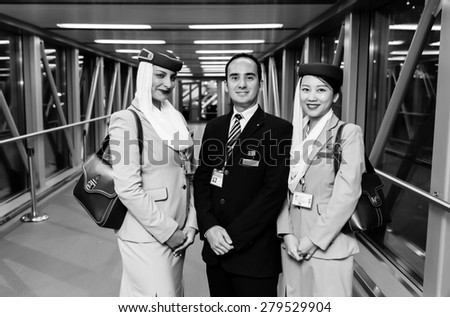 MOSCOW -JUNE 04: Emirates crew members after landing on June 04, 2014 in Moscow, Russia. Emirates handles major part of passenger traffic and aircraft movements at the airport.