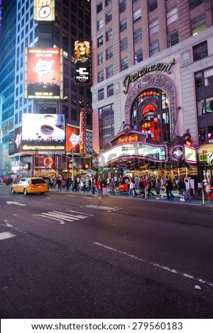 NEW YORK - SEPTEMBER 25, 2011: area around Times Square at night. Times Square is a major commercial intersection and a neighborhood in Midtown Manhattan, New York City