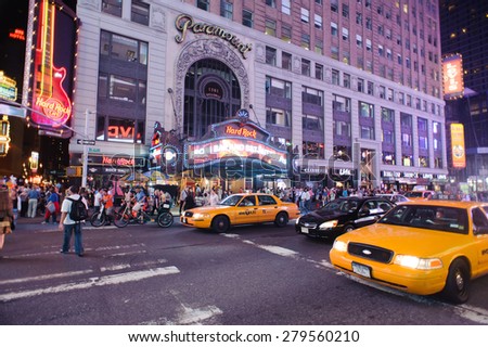 NEW YORK - SEPTEMBER 25, 2011: area around Times Square at night. Times Square is a major commercial intersection and a neighborhood in Midtown Manhattan, New York City