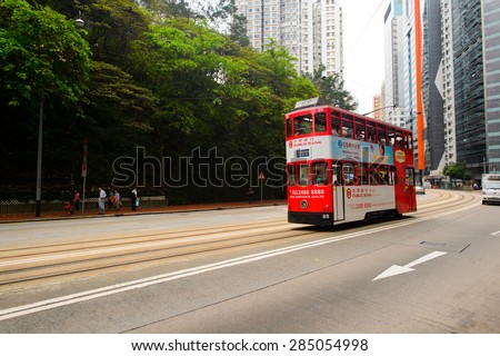 HONG KONG - JUNE 01, 2015: double-decker tram on street of HK. Hong Kong Tramways is a tram system in Hong Kong, being one of the earliest forms of public transport in the metropolis.