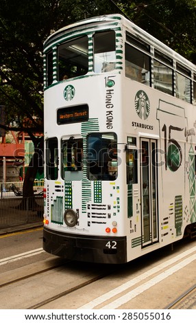 HONG KONG - JUNE 02, 2015: double-decker tram on street of HK. Hong Kong Tramways is a tram system in Hong Kong, being one of the earliest forms of public transport in the metropolis.