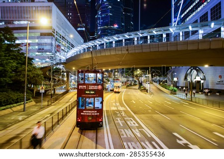 HONG KONG - JUNE 03, 2015: double-decker tram on street of HK. Hong Kong Tramways is a tram system in Hong Kong, being one of the earliest forms of public transport in the metropolis.