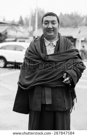 BEIJING, CHINA - APRIL 28:, 2013 Unidentified Monk posing on street of Beijing. Beijing  is the capital of the People\'s Republic of China and one of the most populous cities in the world