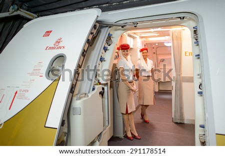 HONG KONG- JUNE 18, 2015: Emirates crew meet passengers on second floor of A380. Emirates is one of two flag carriers of the United Arab Emirates along with Etihad Airways and is based in Dubai
