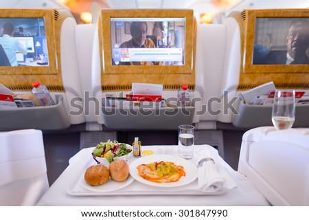 DUBAI - JUNE 23, 2015: Emirates Boeing 777 busines class interior. Emirates handles major part of passenger traffic and aircraft movements at the airport.