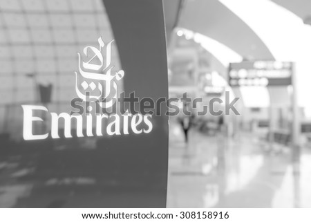 DUBAI, UAE - MARCH 31: Emirates logo on red background. Dubai International Airport is an international airport serving Dubai. It is a major airline hub in the Middle East