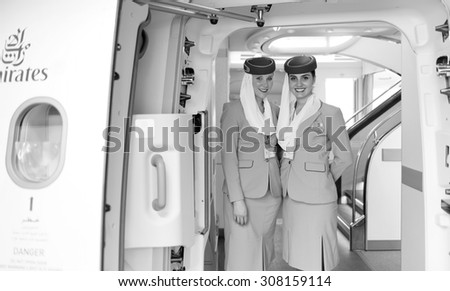 DUBAI - MAY 16: Emirates crew members meet passengers in Airbus A380 aircraft on May 16, 2014 in Dubai, UAE. Emirates handles major part of passenger traffic and aircraft movements at the airport.