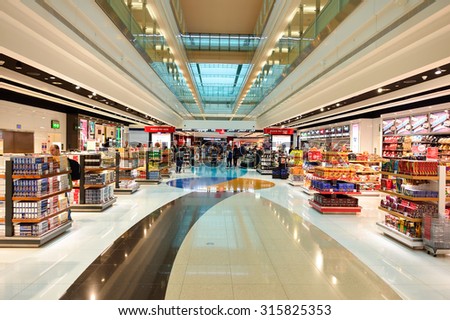 DUBAI - JUNE 23, 2015: The Dubai duty-free shopping area. Dubai International Airport is the primary airport serving Dubai and is the world\'s busiest airport by international passenger traffic