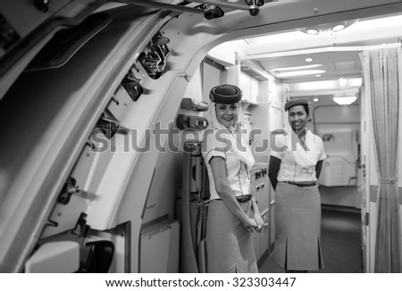 HONG KONG - JUNE 18, 2015: Emirates crew member meet passengers on A380 second floor. Emirates is one of two flag carriers of the United Arab Emirates along with Etihad Airways and is based in Dubai.