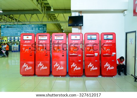 KUALA LUMPUR, MALAYSIA - MAY 02, 2014:  AirAsia self check-in kiosks. AirAsia Berhad is a Malaysian low-cost airline headquartered near Kuala Lumpur, Malaysia