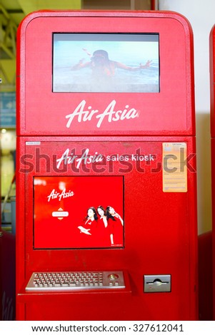 KUALA LUMPUR, MALAYSIA - MAY 02, 2014:  AirAsia self check-in kiosks. AirAsia Berhad is a Malaysian low-cost airline headquartered near Kuala Lumpur, Malaysia