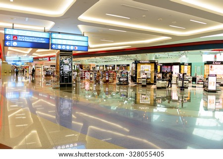 DUBAI, UAE - JUNE 04, 2014: retail area in the concourse A. Dubai Duty Free is the company responsible for the duty-free operations at Dubai International Airport