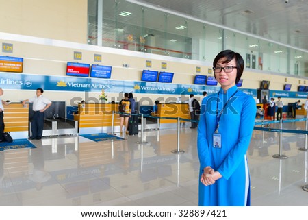 HANOI, VIETNAM - MAY 11, 2015: Vietnam Airlines staff in the airport. Vietnam Airlines has a network within East Asia, Southeast Asia, Europe and Oceania.