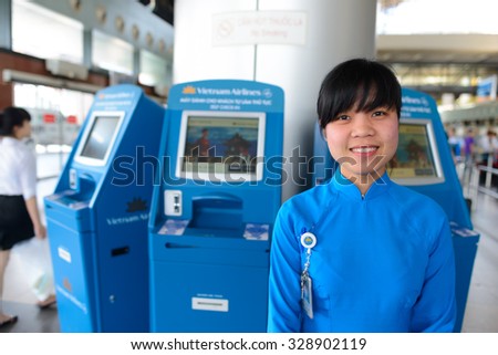 HANOI, VIETNAM - MAY 11, 2015: Vietnam Airlines staff in the airport. Vietnam Airlines has a network within East Asia, Southeast Asia, Europe and Oceania.