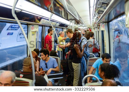 PARIS - AUGUST 10, 2015: people in Paris Metropolitain train. The Paris Metro or Metropolitain is a rapid transit system in the Paris Metropolitan Area