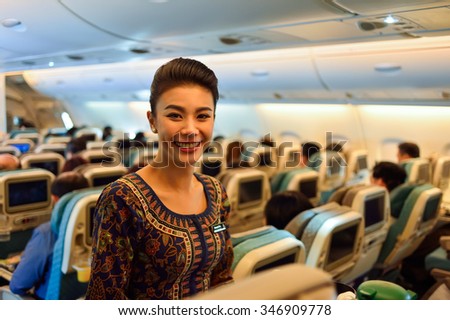 SINGAPORE - NOVEMBER 03, 2015: Singapore Airlines crew member on board of Airbus A380. Singapore Airlines Limited is the flag carrier of Singapore which operates from its hub at Changi Airport