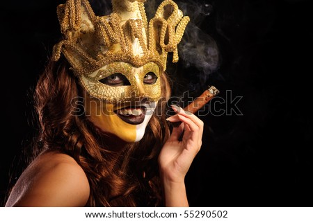 smoking girl in golden half mask, isolated on black