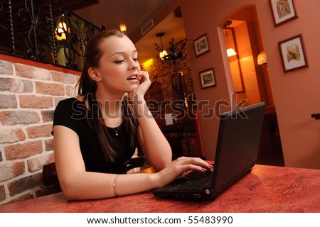 young beauty girl surf the Internet in cafe, may be use for wi-fi concept