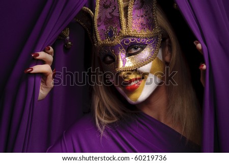 smiling woman in violet mask open curtain, may be use for theater concept