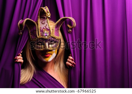 woman in violet mask opening curtain, may be use for theater concept