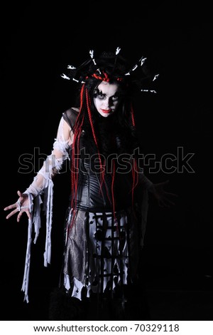 portrait of vampire woman with stage makeup isolated on black