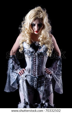 portrait of vampire woman with stage makeup isolated on black
