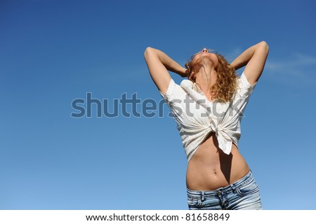 expressing beauty blonde woman, isolated on blue sky