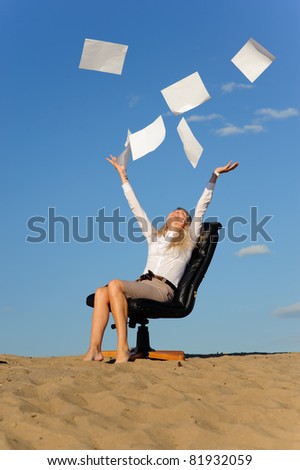 business woman sit in armchair and scatter paper
