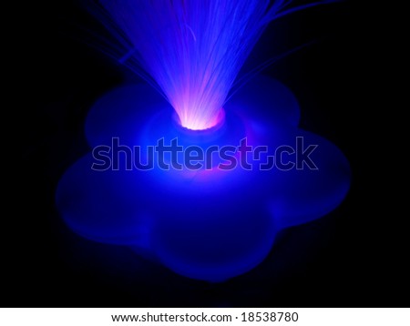Glowing star shaped fiber optic light base