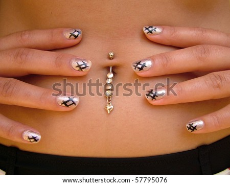 Interesting navel piercing with cool painted finger nails