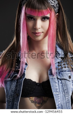 Portrait of a young punk girl with a nice hair cut in pink Portrait of a young punk girl with a nice hair cut in pink