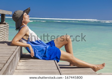 Beautiful woman relaxing on a beautiful tropical beach