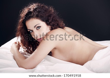 Sexy and beautiful woman on the bed relaxing