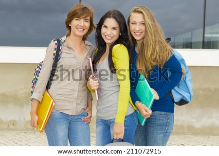 Happy group of beautiful female students in the school