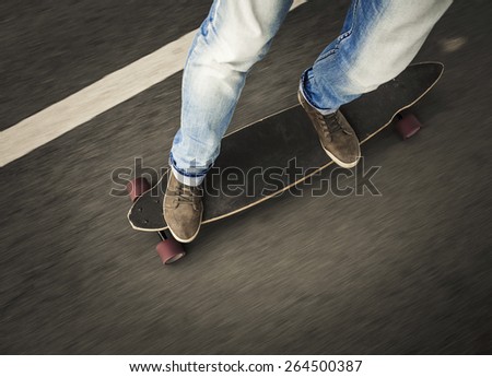 Detail of a young man feet riding a skateboard