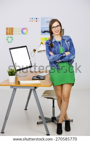 Woman working at desk In a creative office, breaking time