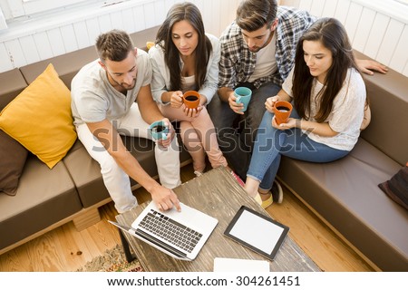 Group of friends at local Coffee Shop studying