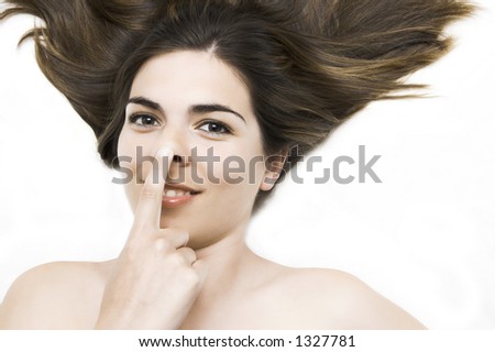 Young woman with the finger in the nose
